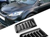 a close up of a car and a pair of vents on a white surface