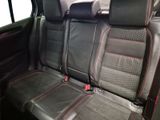 the back seats of a car are black with red stitching