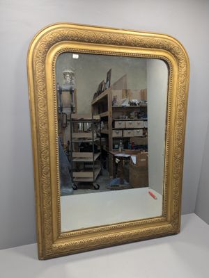 grand miroir à cadre doré, au motif ouvragé et au cadre doré
