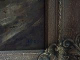 a close up of a statue of a bird on a ledge