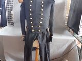 a mannequin dressed in a military uniform on a stand