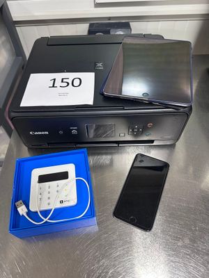 an image of a printer and a cell phone on a table