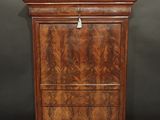 an antique walnut chest of drawers with marble top