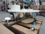 a picture of a machine that is on a pallet in a warehouse