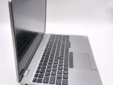 a close up of a laptop computer on a white surface