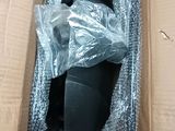 a cardboard box with a black object inside of it
