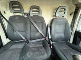 two black seats in the back of a van