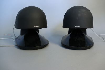two black speakers sitting on top of each other