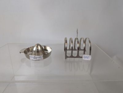 a silver object on a glass table next to a silver object
