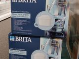 deux boîtes de cartouches filtrantes Brita sur une étagère dans un magasin