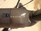 a close up view of a bicycle handlebar with a logo on it