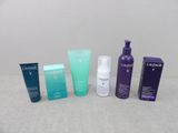 several different types of skin care products sitting on a table