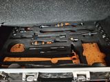 a tool case with tools in it sitting on a table