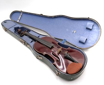 a violin in a case on a white surface