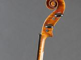 an old violin with a long neck and a long tail