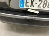 a sticker on the bumper of a car that has a sticker on it