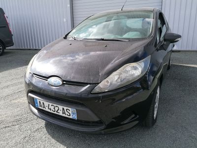 a black car parked in front of a building