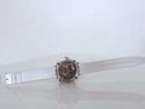 a watch that is sitting on a white surface