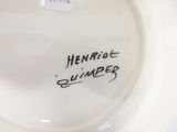 a white plate with writing on it on a table