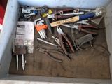 a box full of tools that are sitting on the floor