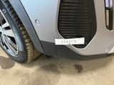 a close up of a car ' s grille with a sticker on it