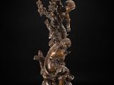 a bronze statue of a woman and child on a pedestal