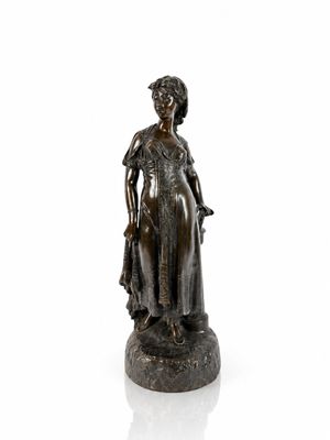 bronze statue of a woman in a dress and hat