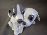 a figurine of a dog and a cat on a table