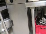 a kitchen with a sink, stove, and dishwasher in it