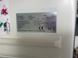 an image of a refrigerator with a price label on it