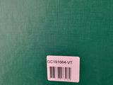 a close up of the label on the back of a green chair