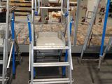 many ladders that are sitting in a room