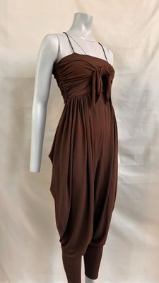 the mannequin is wearing a brown dress on a white mannequin