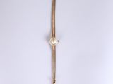 a close up of a wrist watch on a white surface