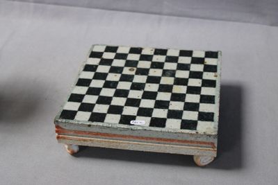 a small black and white checkered box next to a small black and white checkerboard box