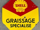 a red and yellow stop sign with a shell logo on it