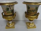 two vases that have been painted with a landscape on them