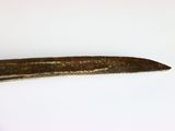 a small piece of metal that has been placed on a white surface