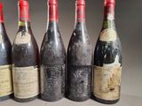 six bottles of wine are lined up in a row