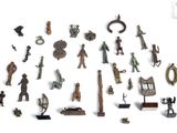 many different types of figurines displayed on a white surface