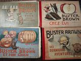 four vintage children ' s books are lined up on a table