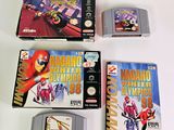 four nintendo games on the table with one being played