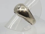 sterling silver ring with a single diamond set in the center