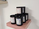 a shelf that has a bunch of candles on it