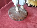 a figurine of a man on a horse on a table