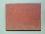 an image of a red notebook with a pattern on the cover