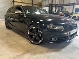 an image of a black audi car parked in a garage