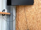a flat screen tv mounted on a wall in a room