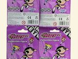 three packs of toothpaste with cartoon characters on them