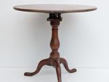 an image of a small table with a wooden top on a white floor